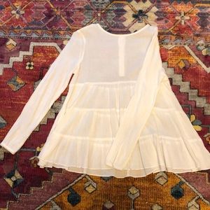 Sheer swing top with back button detail